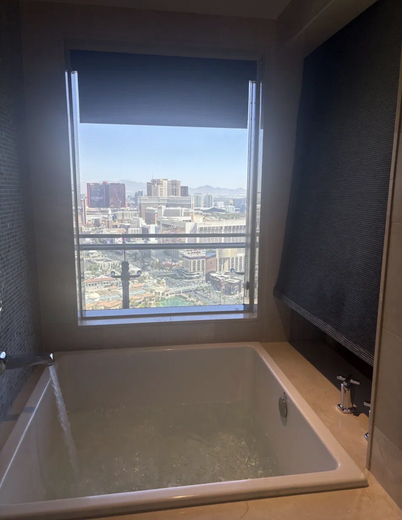 Japanese soaking tub in a Cosmopolitan Las Vegas room looking out over the Bellagio fountains