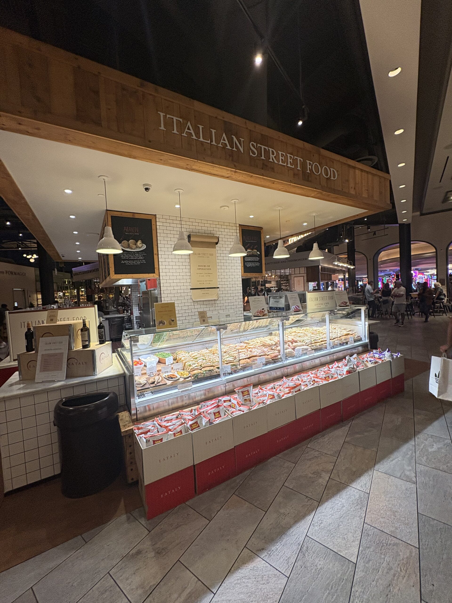 Italian Street Food counter with sandwiches on display at Eataly Park MGM