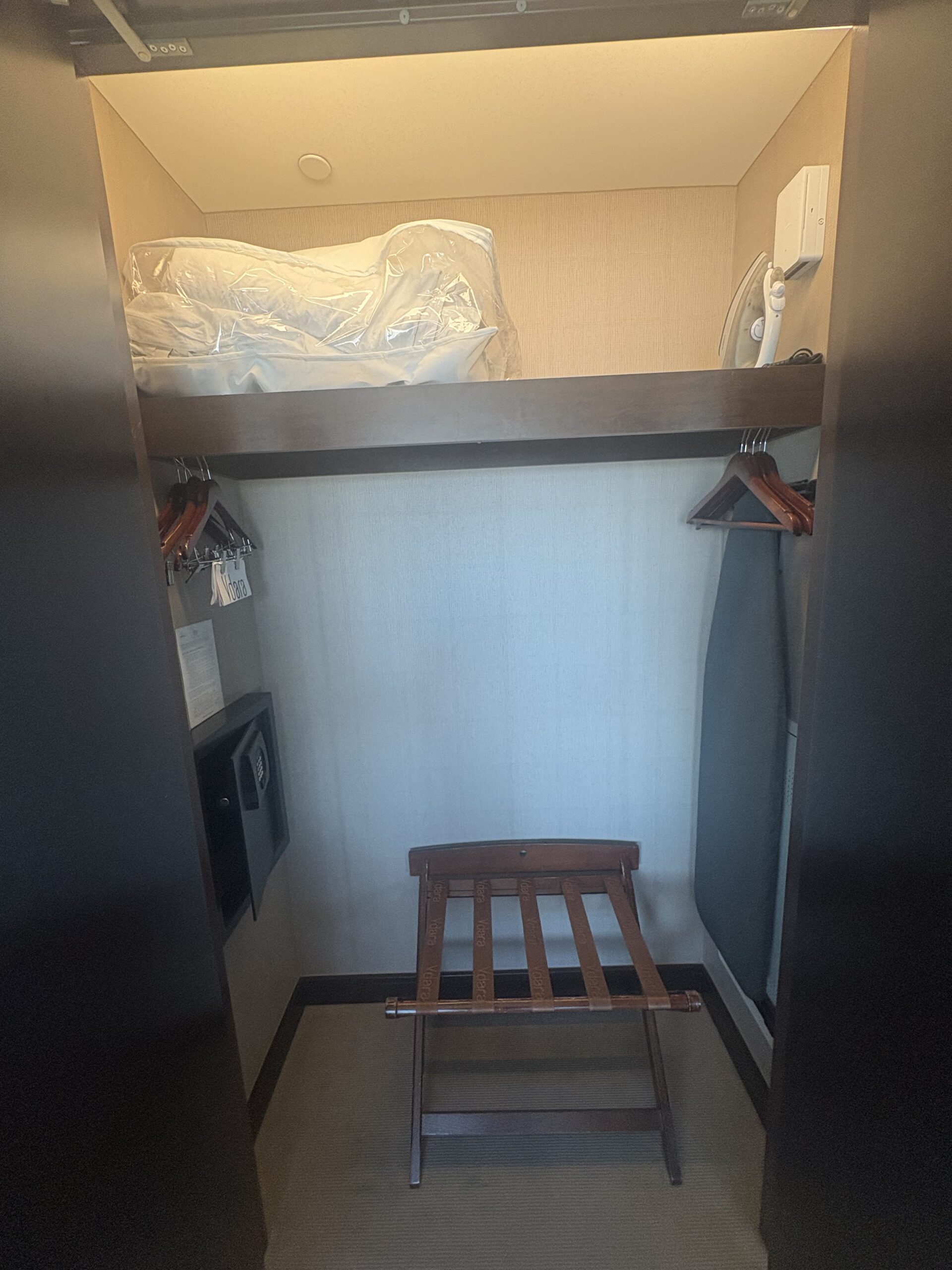 Vdara hotel closet with safe, iron, luggage rack, and spare comforter