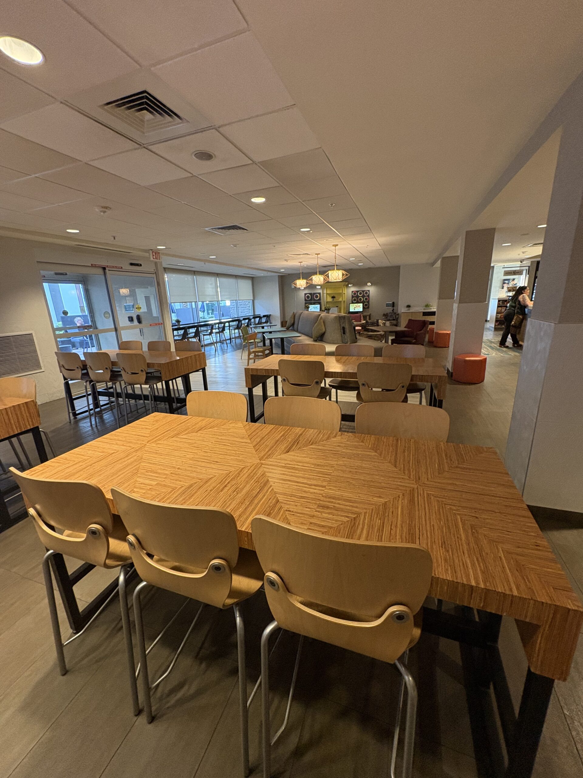 Breakfast and communal seating area at Home2 Suites by Hilton Las Vegas Stadium District