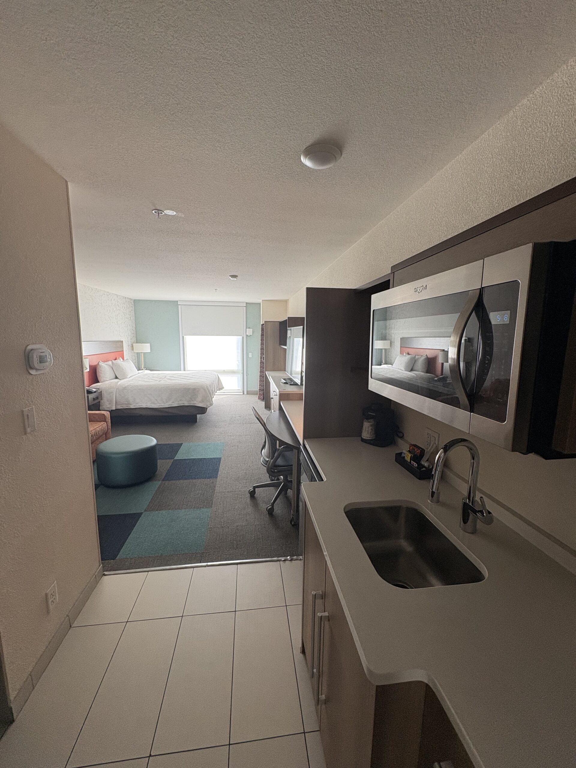 Kitchenette with full-size sink and microwave in Home2 Suites Las Vegas Stadium District