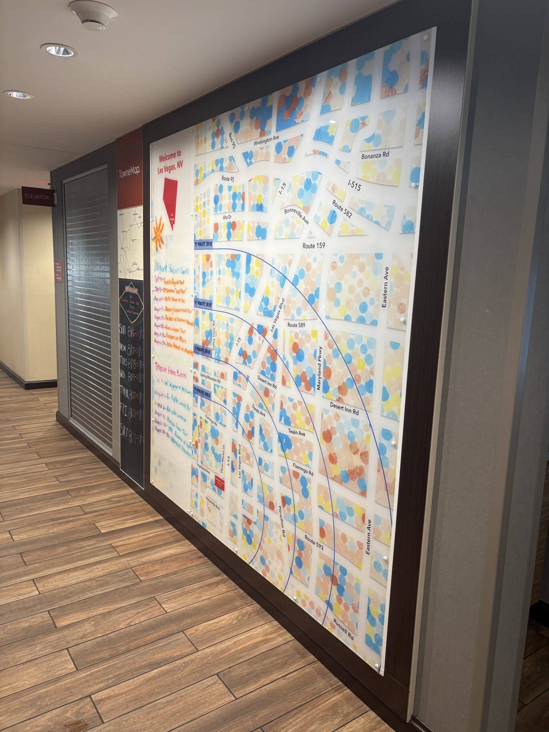 TowneMap wall showing walk times to Allegiant Stadium and T-Mobile Arena at TownePlace Suites