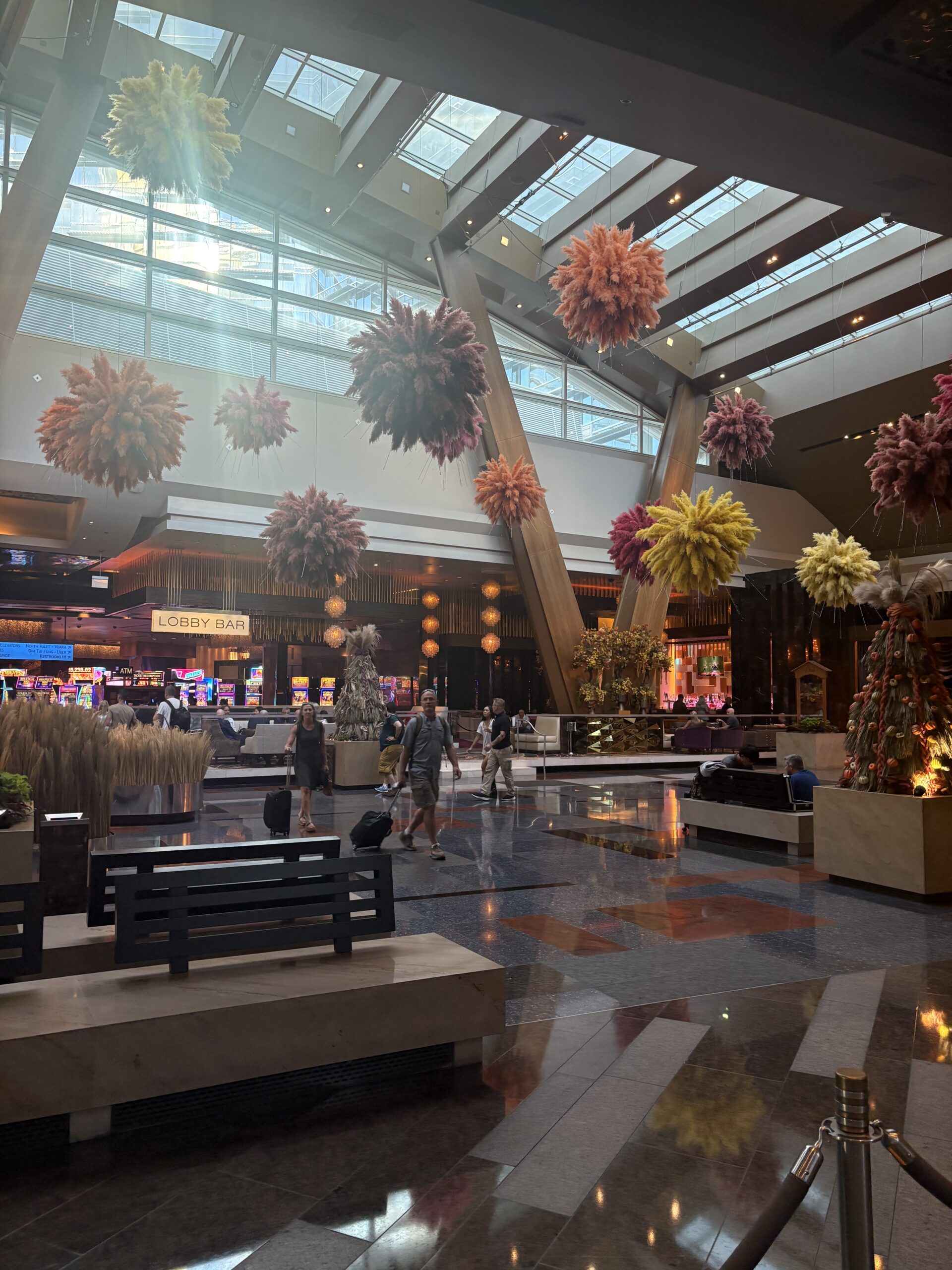 Aria lobby with hanging fall pampas-grass clusters and the Lobby Bar