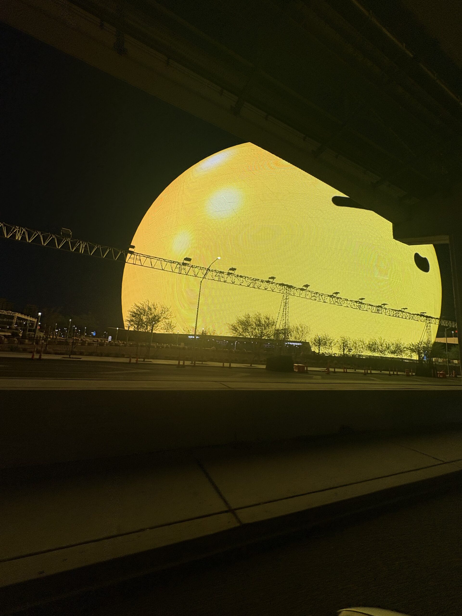 Las Vegas Grand Prix track lighting truss stretching across the glowing Sphere