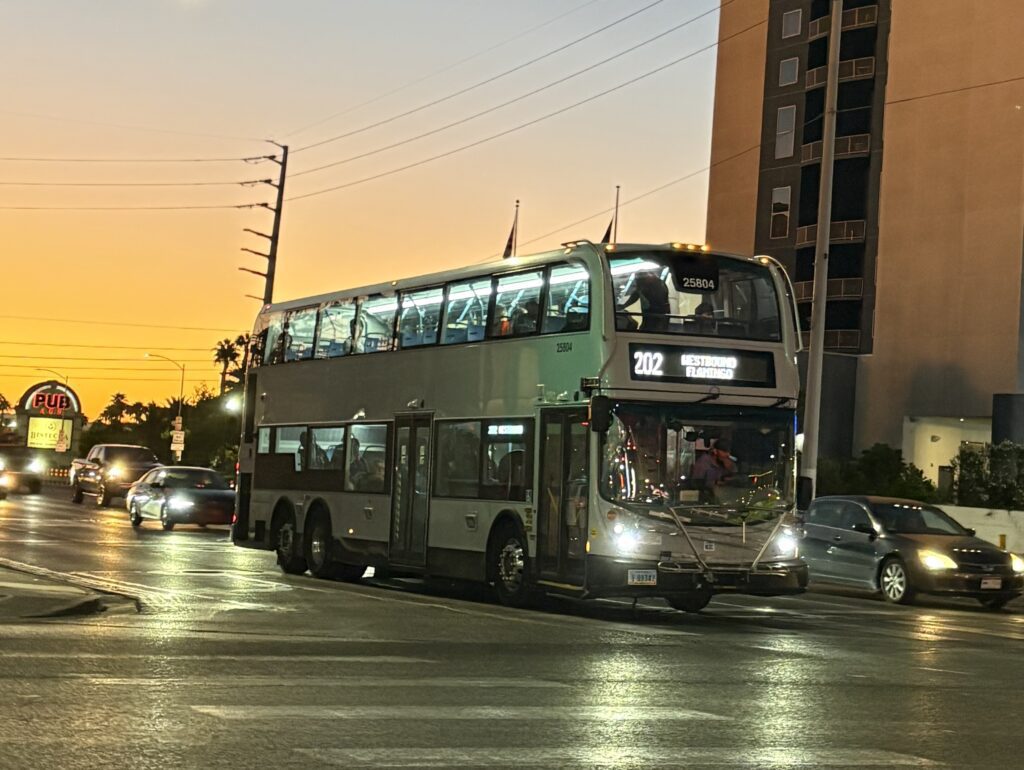 RTC Route 202 westbound Flamingo double-decker bus at sunset in Las Vegas
