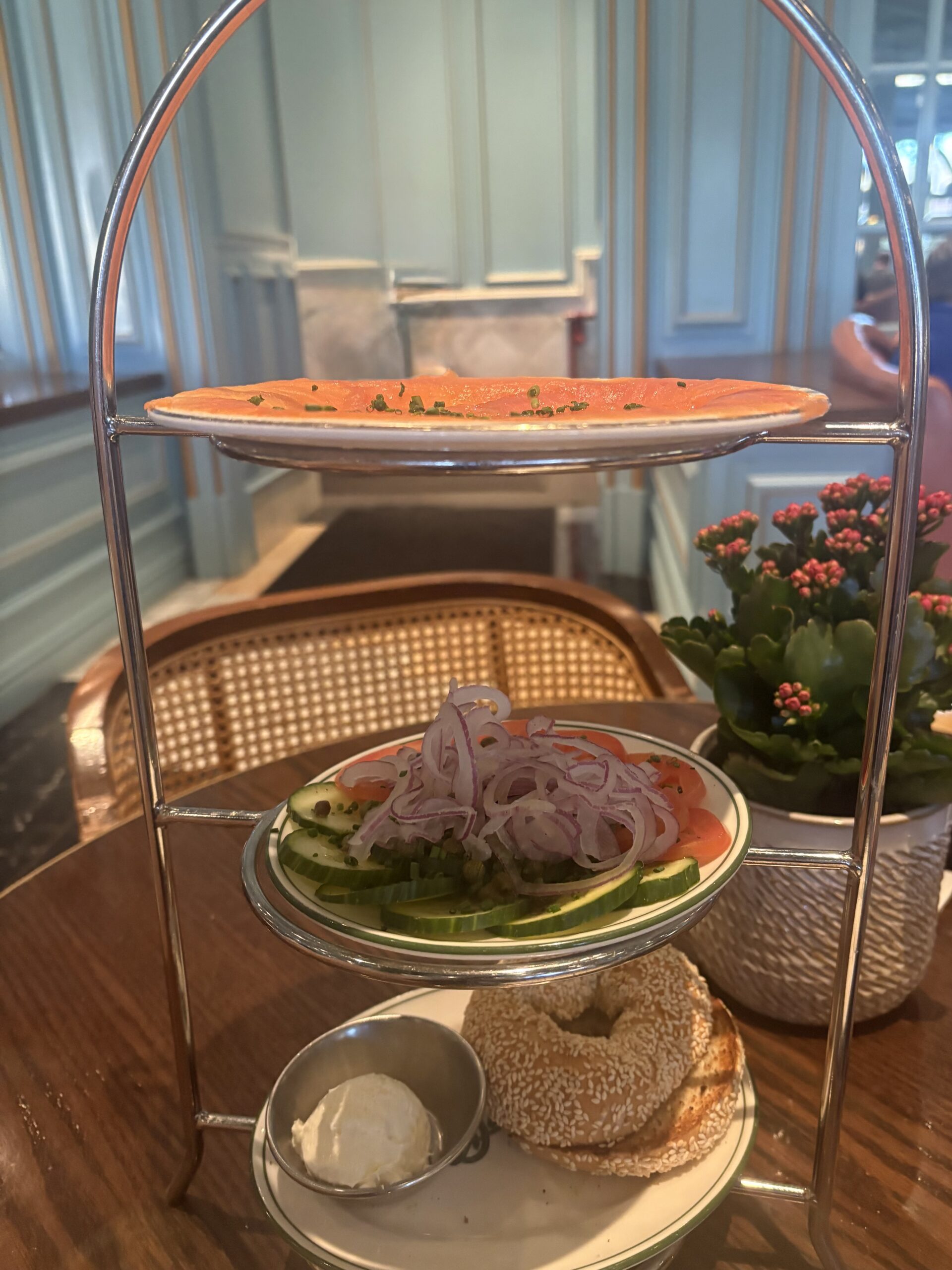 Smoked salmon tower at Sadelle's Bellagio with tomato, cucumber, onion, capers, and a sesame bagel with cream cheese