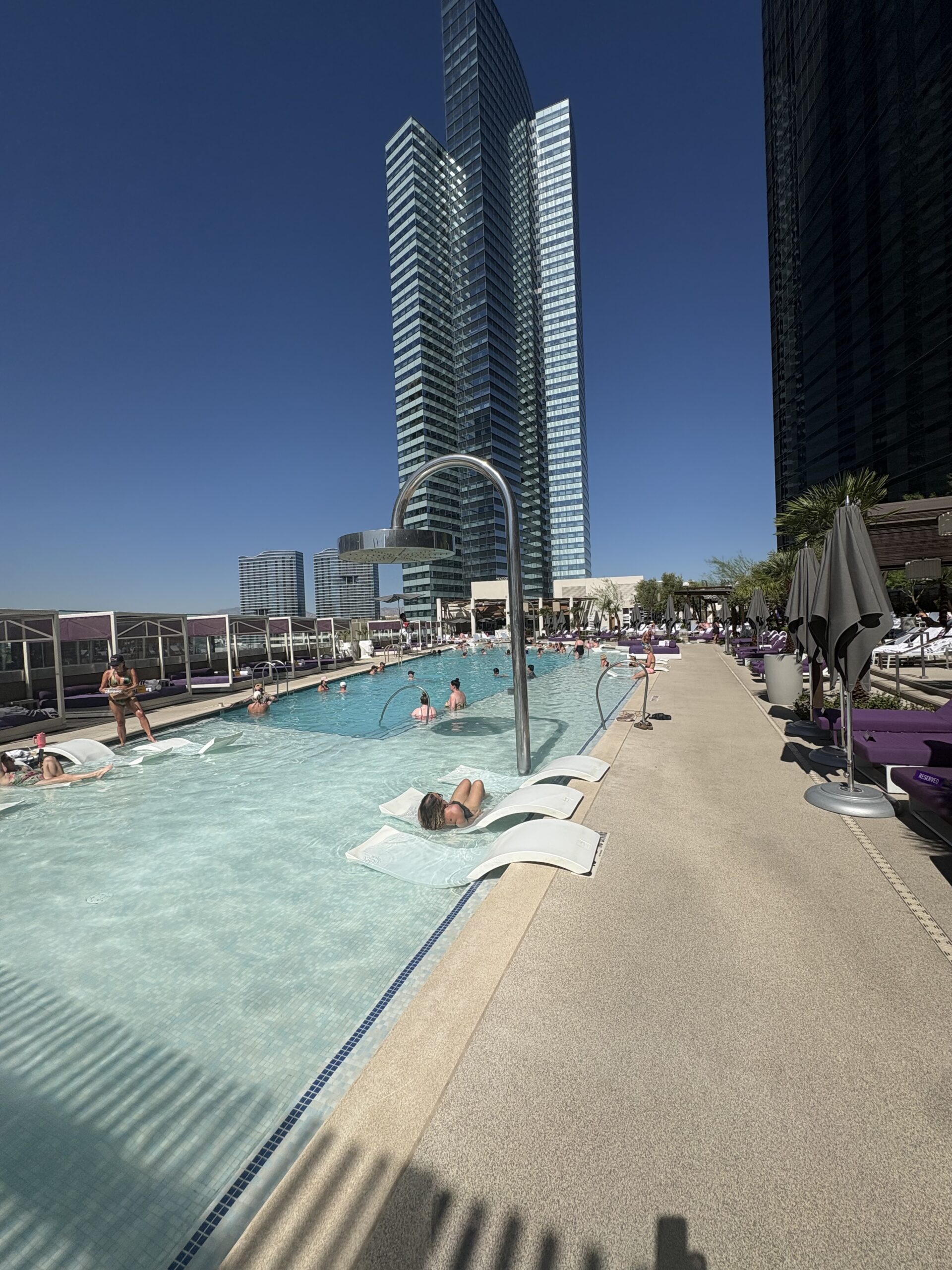 Chelsea Pool at the Cosmopolitan Las Vegas, with in-water loungers, cabanas and CityCenter towers behind