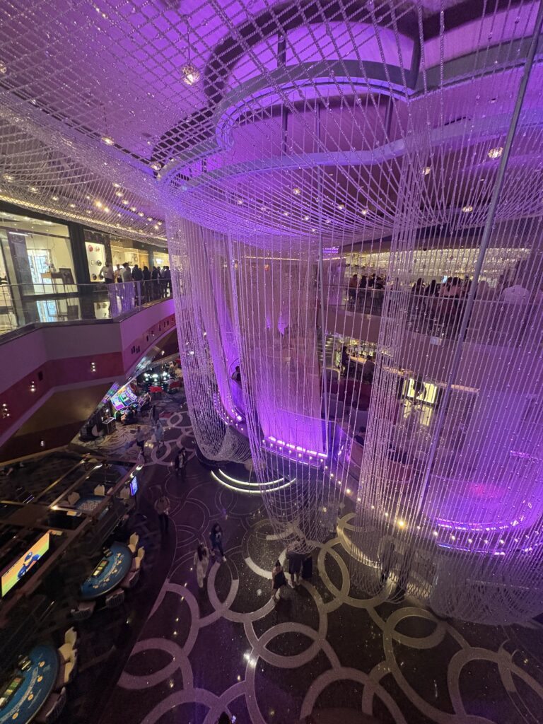 The Chandelier Bar at the Cosmopolitan Las Vegas, with crystal strands wrapping three levels in purple light