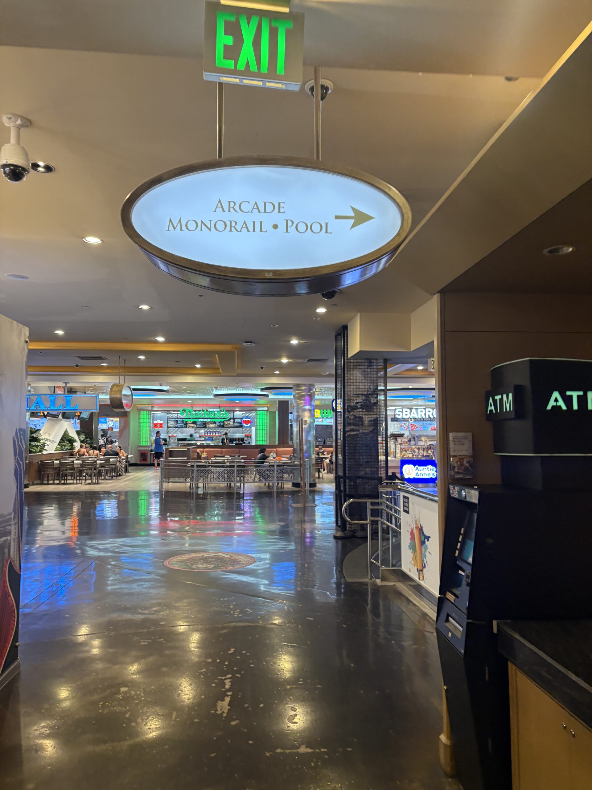 Overhead sign inside Horseshoe Las Vegas pointing to the arcade, Monorail and pool, near the food court